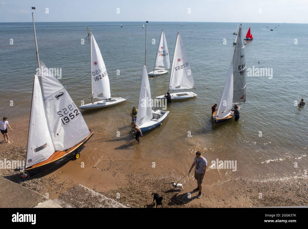 Sidmouth, Devon, UK. 29th August 2021. A sailing regatta was the highlight of Bank Holiday Sunday at Sidmouth, Devon. Glorious weather is expected to continue into next week across the South West. Credit: Photo Central/Alamy Live News Stock Photo