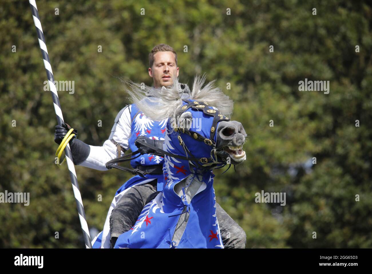 Herstmonceux,UK. 29th Aug 2021.  England's medieval festival continues today with a Knights tournament and jousting from the spectacular Pferdestunt company.The festival runs over the bank holiday weekend & attracts thousands of visitors interested in everything medieval. Credit: Ed Brown/Alamy Live News Stock Photo