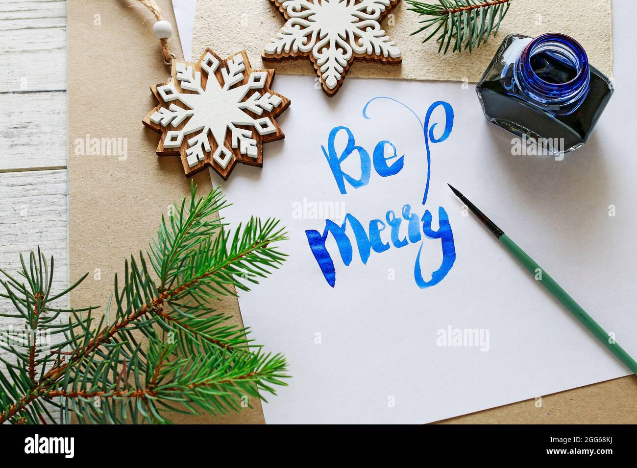 Be Merry - calligraphy, handwritten letters on white paper. Retro style ...