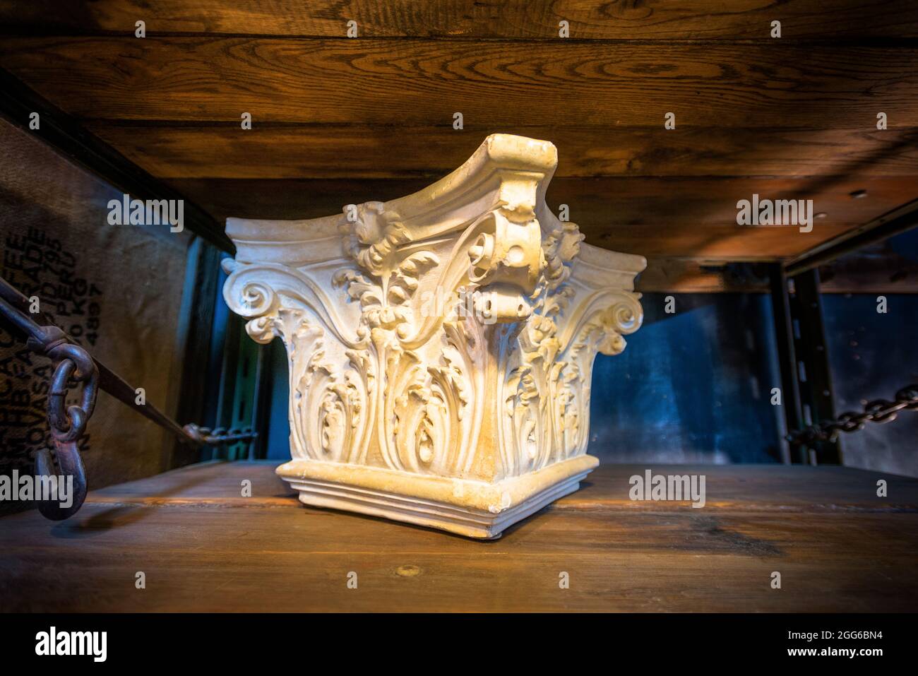 Corinthian Capital in architectural salvage warehouse. Stock Photo