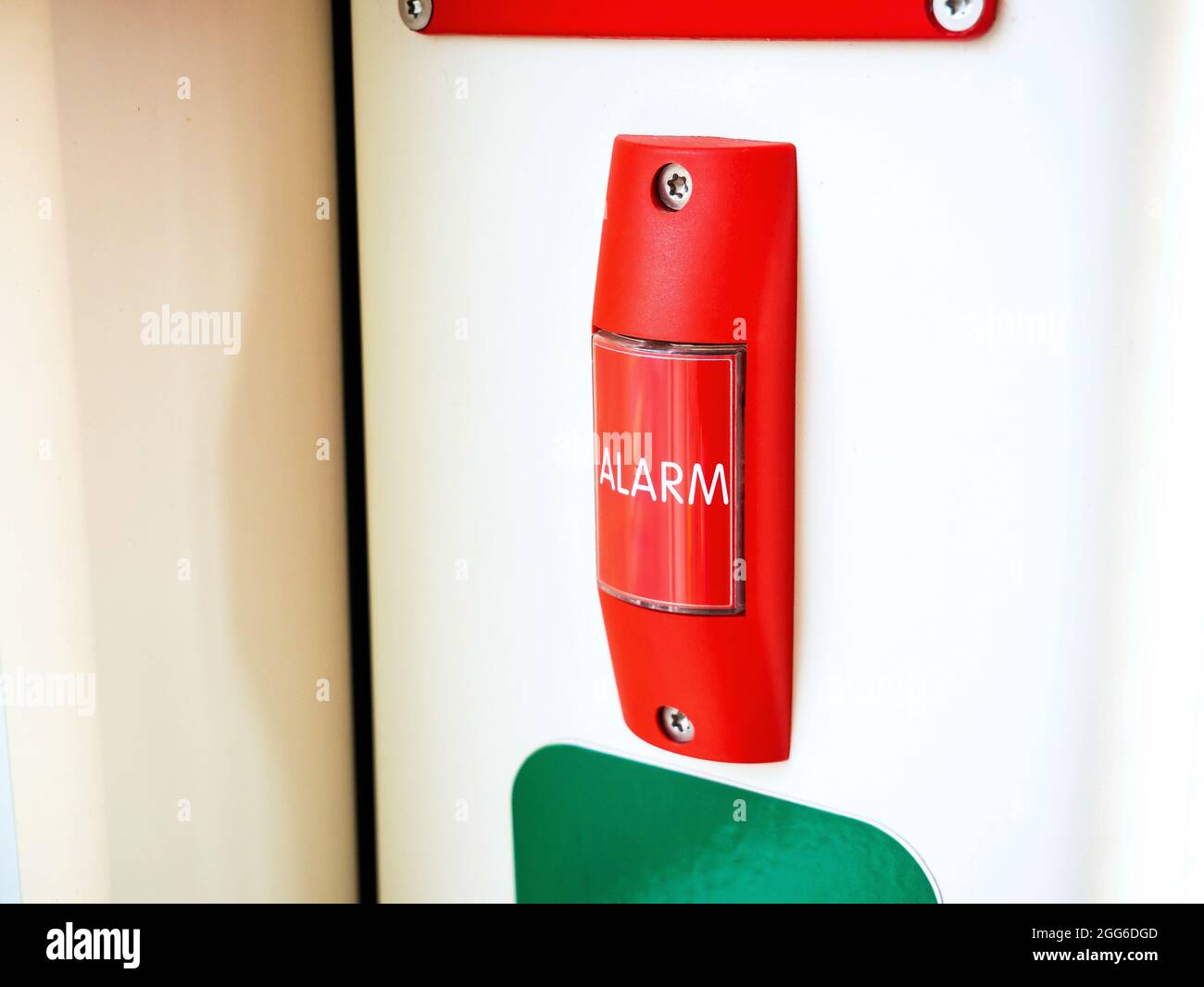 Red alarm button, public transport emergency safety switch, object closeup, nobody. City