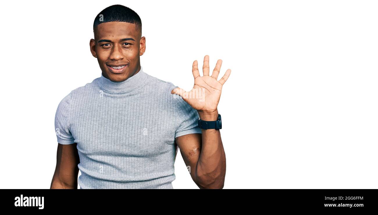 Young black man wearing casual t shirt showing and pointing up with ...