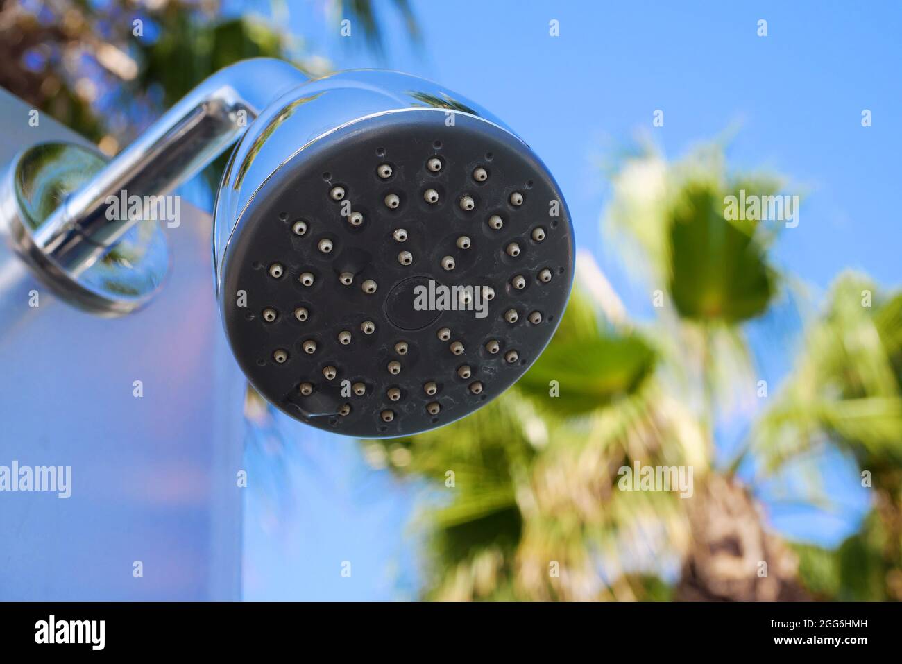 Closeup of outdoor shower head. Outdoor pool shower. Bootom view of