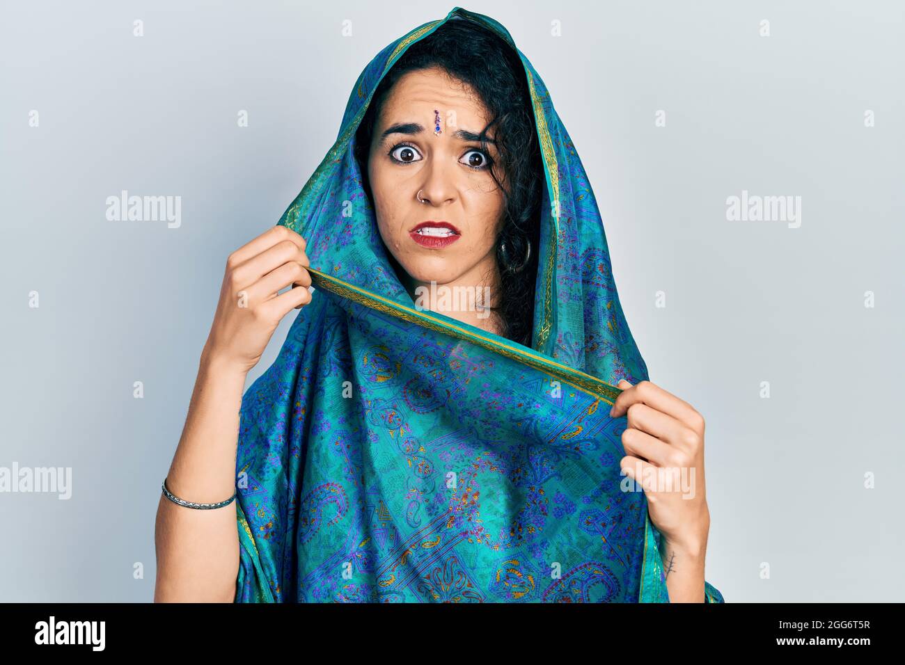 Young woman wearing bindi wearing traditional indian saree surprised ...