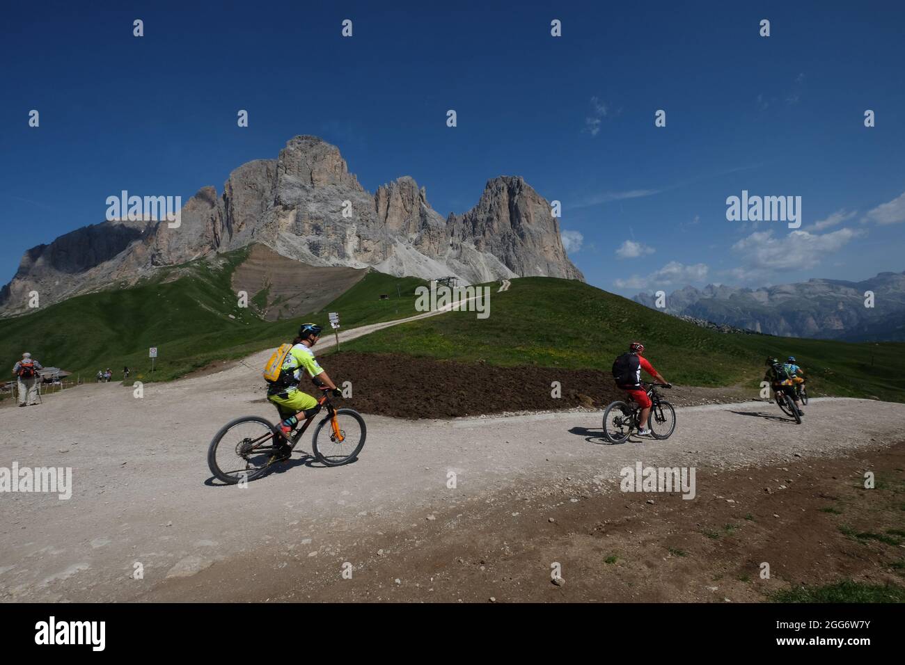 biker on high mountain road, Italian Dolomites, Trentino Alto Adige Italy Stock Photo