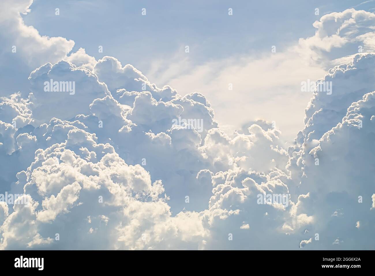 huge White fluffy cloud against  blue sky summer abstract weather background. Stock Photo
