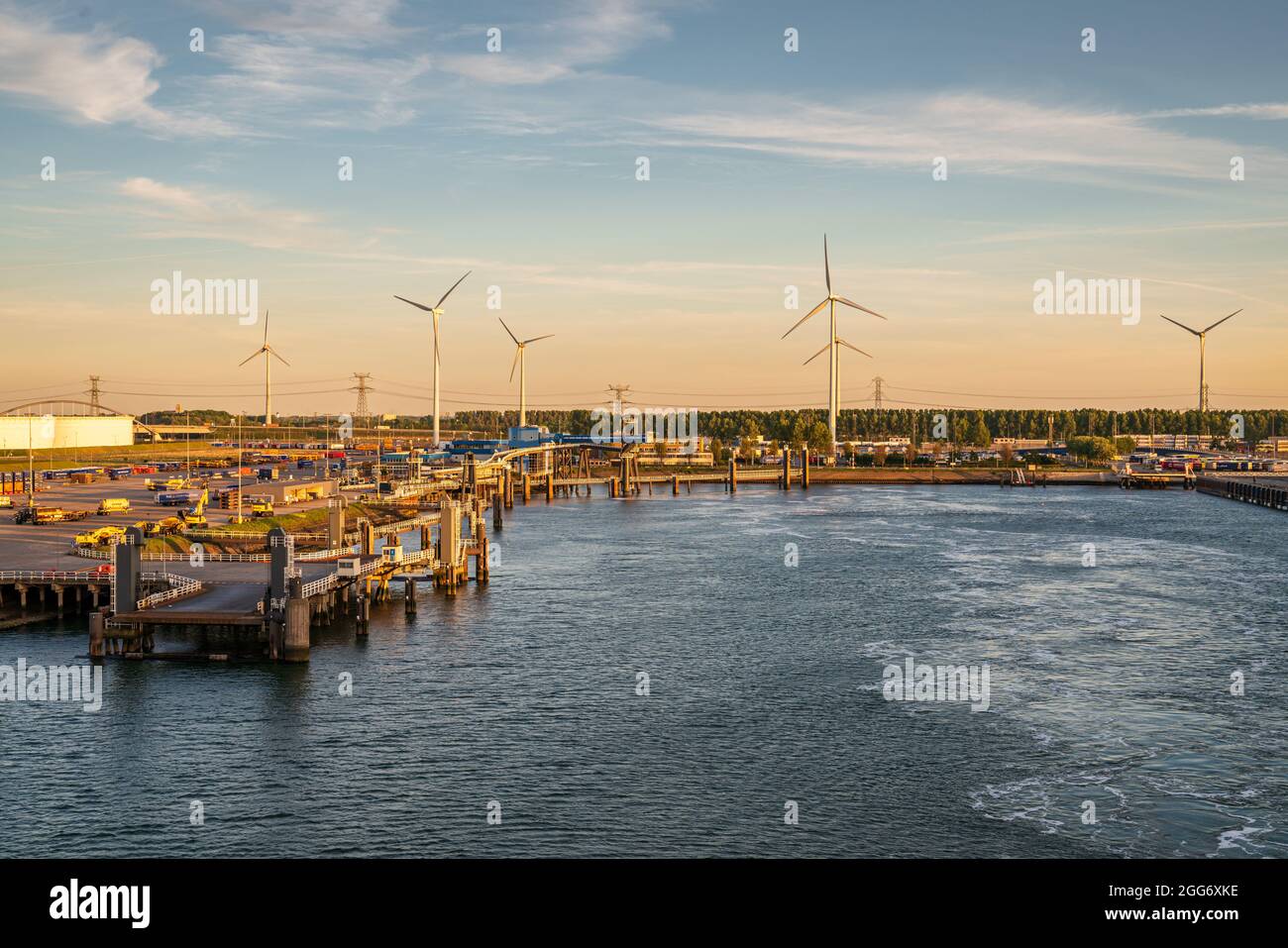 Rotterdam, South Holland, Netherlands - May 13, 2019: Wind turbines and the ferry terminal in the Beneluxhaven of Europoort Stock Photo