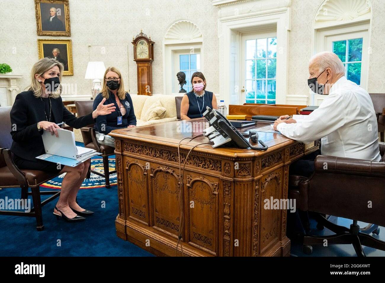 Washington, United States Of America. 27th Aug, 2021. U.S President Joe Biden and members of his team, hold a call with the Governors of Louisiana, Alabama, and Mississippi to discuss preparations for Hurricane Ida from the Oval Office of the White House August 27, 2021 in Washington, DC. Sitting from left to right are: Homeland Security Advisor Liz Sherwood-Randall, FEMA Administrator Deanne Criswell, and Director of Intergovernmental Affairs Julie Rodriguez Credit: Planetpix/Alamy Live News Stock Photo