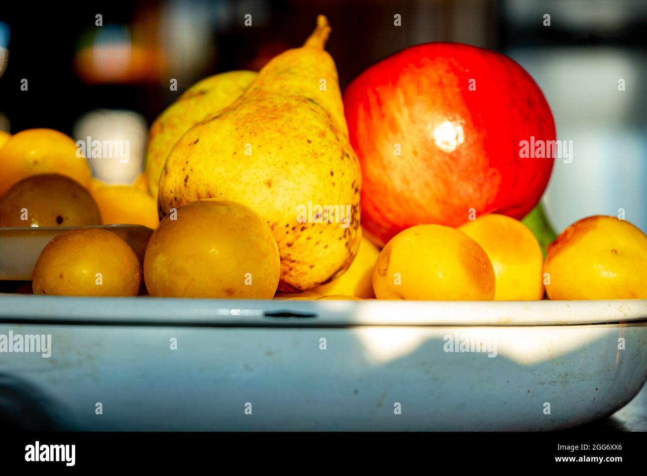 dish with pears, plums and apples Stock Photo