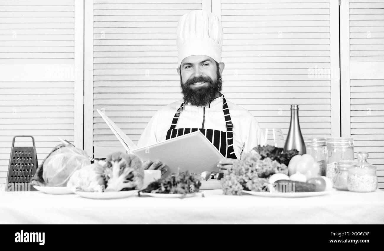Time for healthy snack. Happy bearded man. chef recipe. Dieting organic food. Vegetarian salad with fresh vegetables. Healthy food cooking. Mature Stock Photo