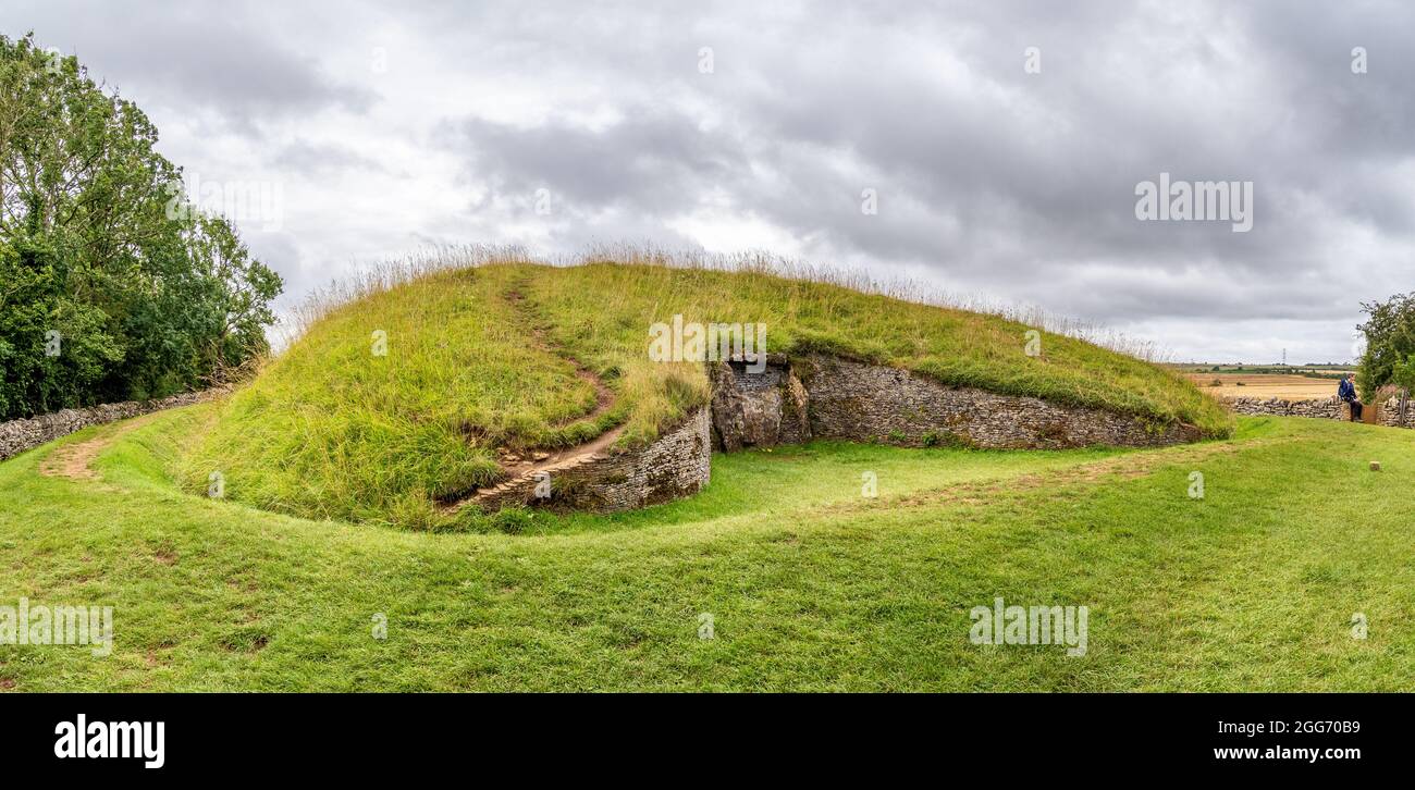 Belas Knap a large Neolithic long barrow above Winchcombe in the Cotswold Hills in Gloucestershire UK seen from its imposing false entrance Stock Photo