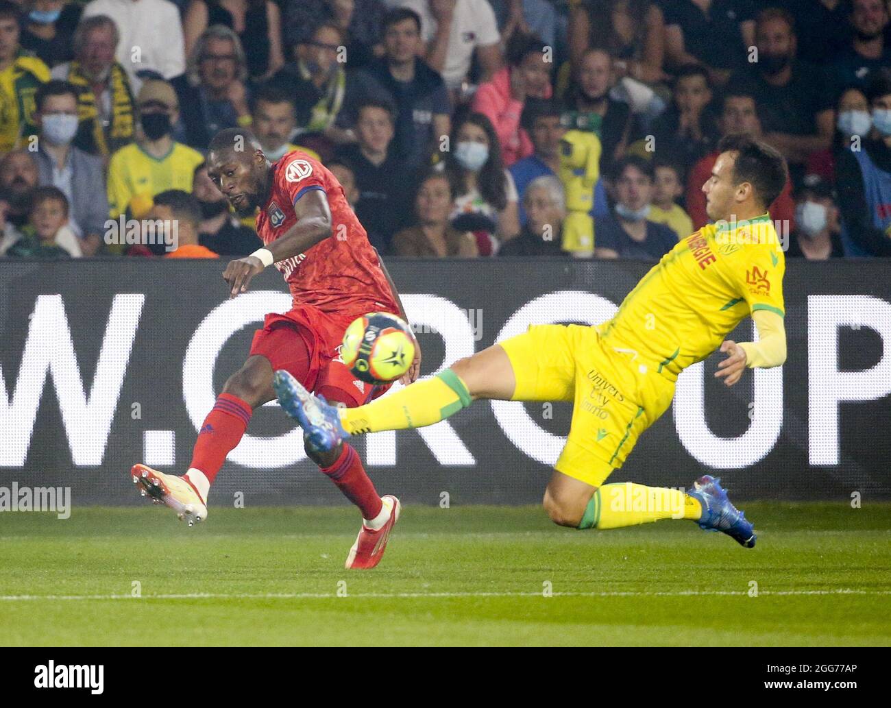 Karl Toko Ekambi of Lyon, Andrei Girotto of Nantes during the French  championship Ligue 1 football match between FC Nantes and Olympique  Lyonnais (OL) on August 27, 2021 at Stade de La