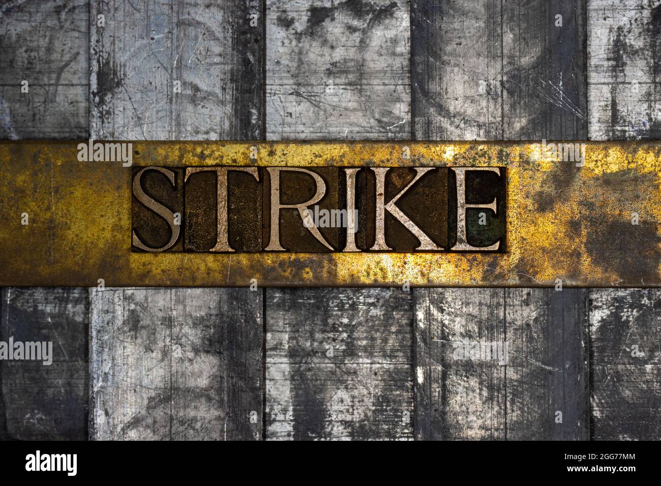 Strike text message on textured grunge copper and vintage gold ...