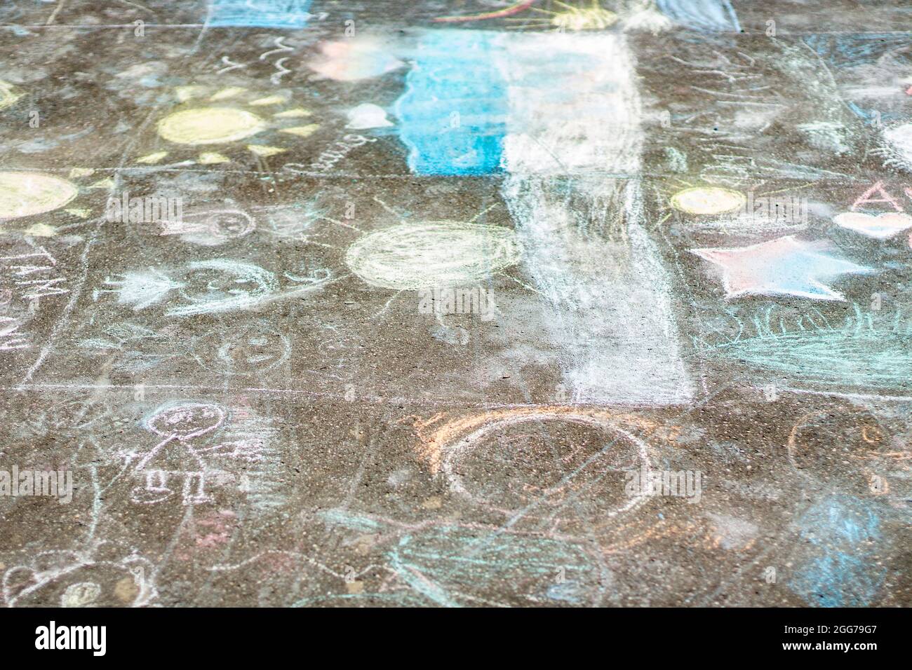 Drawing in chalk on the asphalt. The children painted the asphalt with ...