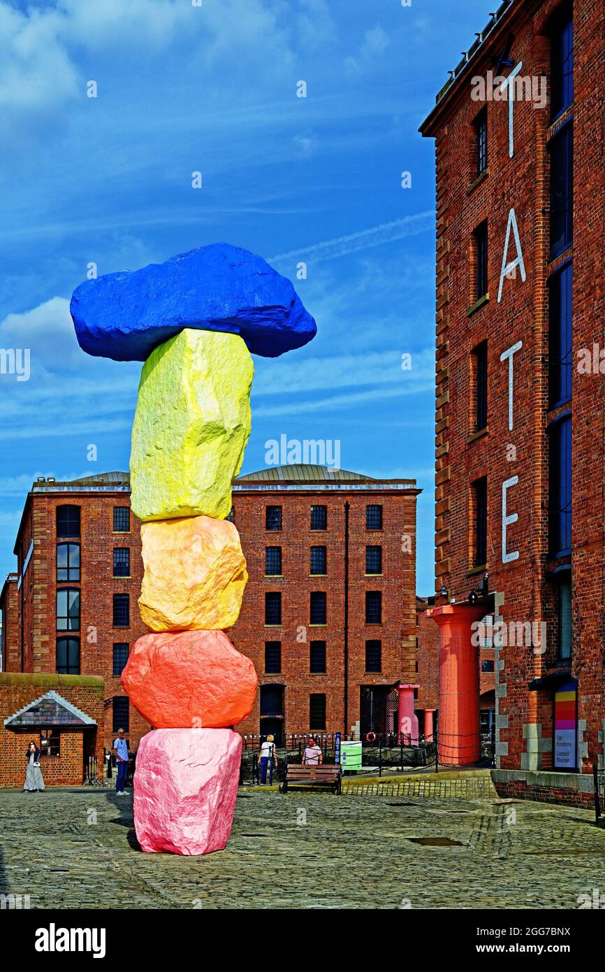 Coloured rock sculpture 10 metre high called Liverpool Mountain in Mermaid Courtyard Albert dock Liverpool Tate by the Swiss-artist Ugo Rondinone Stock Photo