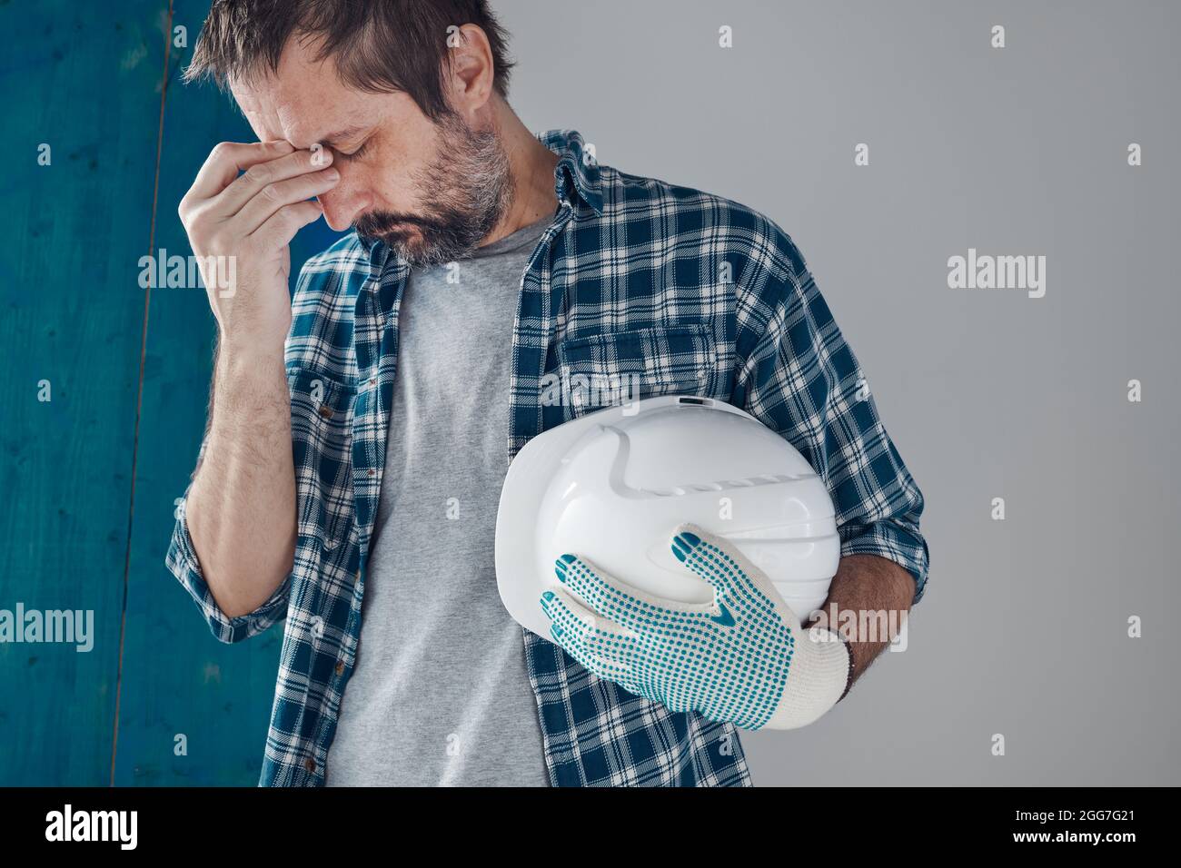 Tired and worried construction industry engineer feeling exhausted and disappointed Stock Photo