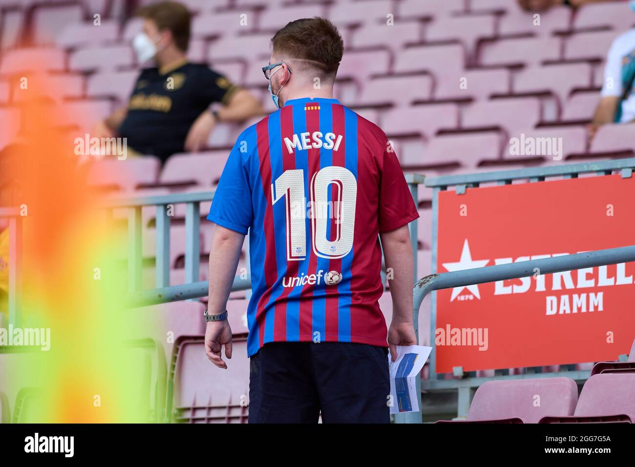 Barcelona, Spain. . 29th Aug, 2021. FC Barcelona supporter wears a Leo  Messi tshirt from the 2021/22 season during the Liga match between FC  Barcelona and Getafe CF at Camp Nou in