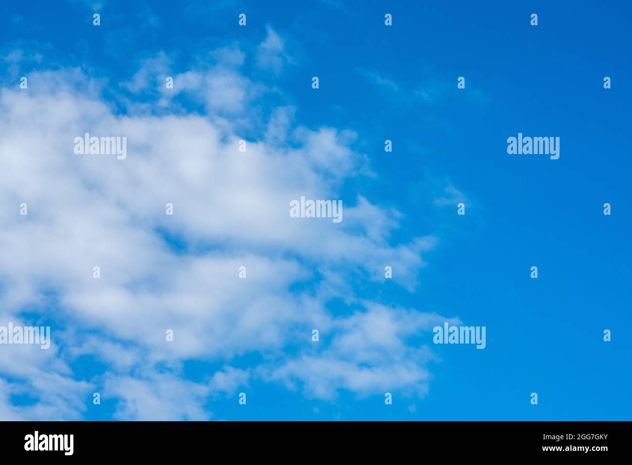 white clouds in bright blue sky Stock Photo
