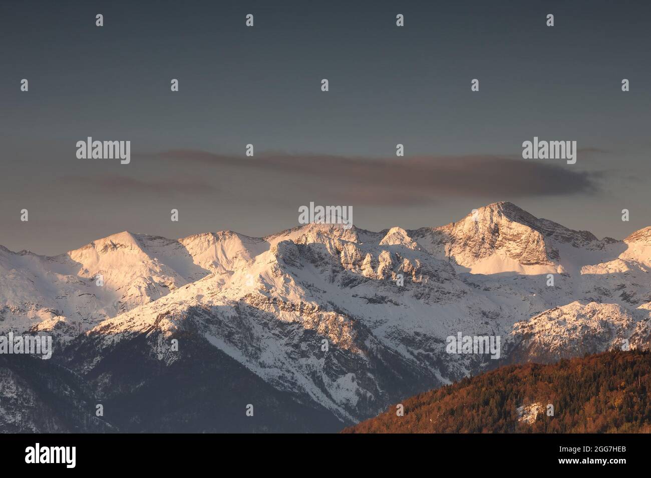 mountain peaks in winter at sunrise, Slovenia Stock Photo
