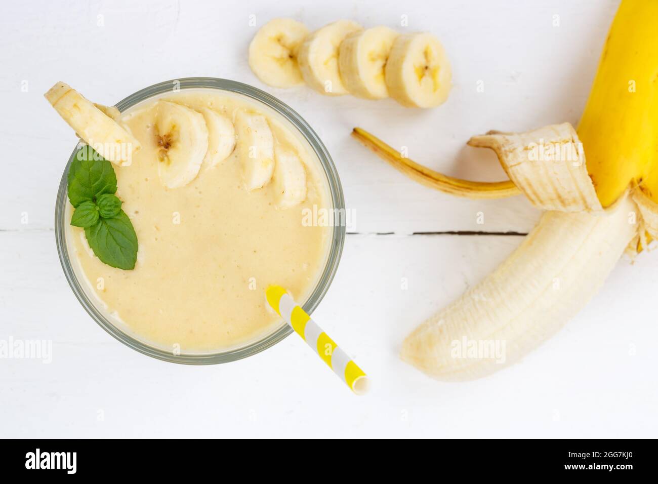 Banana fruit juice smoothie fresh drink in a glass from above healthy