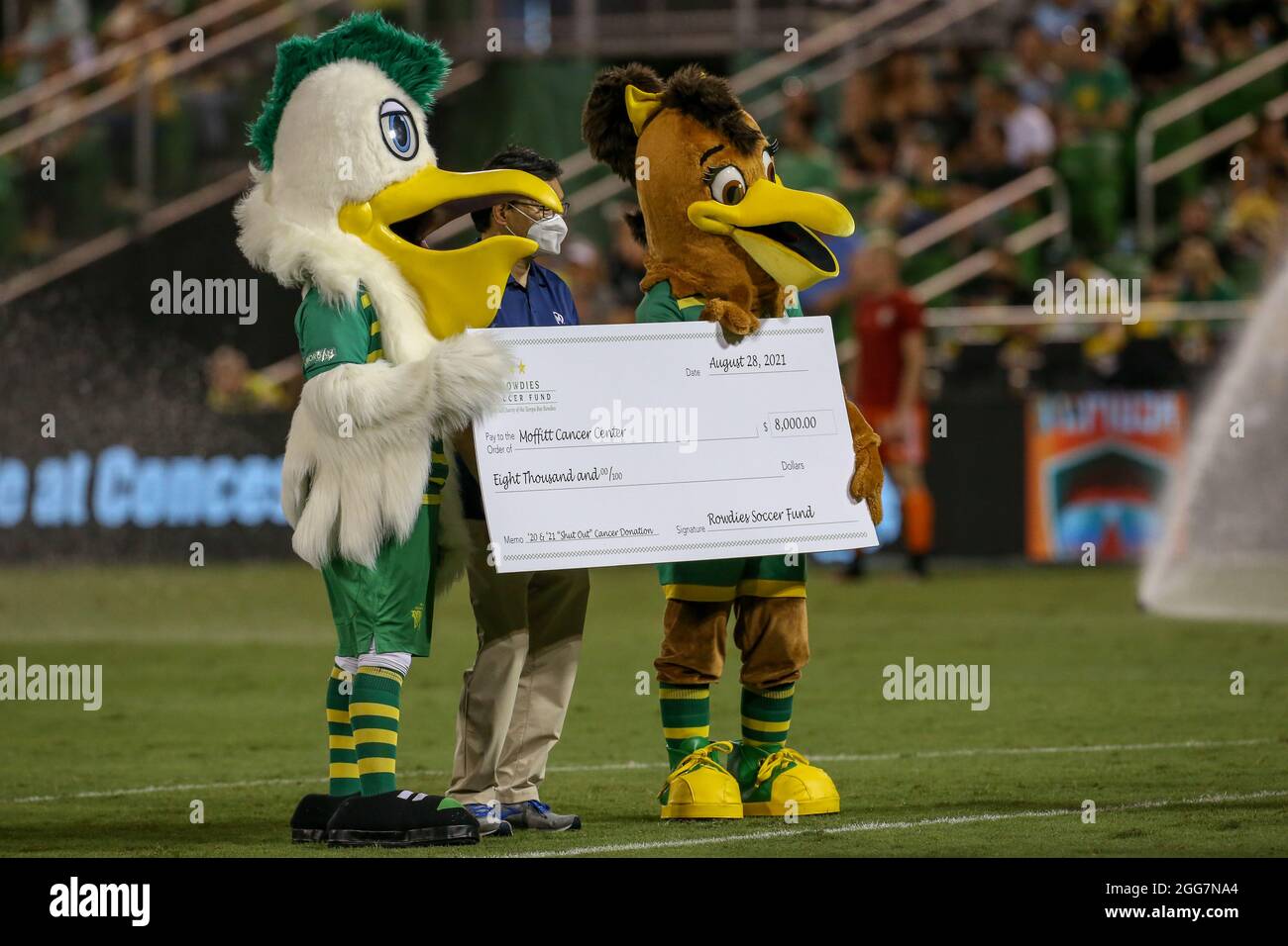 St. Petersburg, FL USA; Tampa Bay Rowdies mascots Pete and Pinnie present a  check to Moffit Cancer Hospital at the half during a USL soccer game  against the Charlotte Independence, Saturday, August