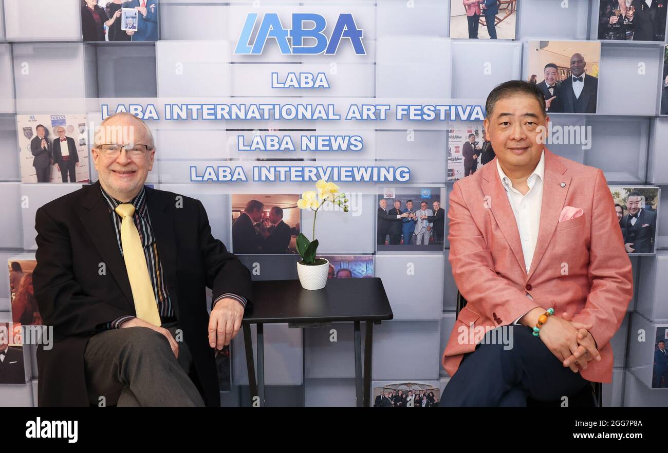 Los Angeles, California, USA. 27th August, 2021. Director Harrison Engle is interviewed by TV host Joey Zhou on 'Hollywood and the Pandemic Recovery' held at a media studio in Los Angeles, California.  Credit: Sheri Determan Stock Photo