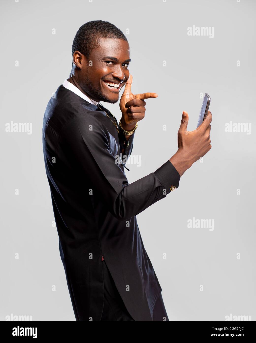Happy Viewing handsome young african man feeling excited and happy viewing content on ...