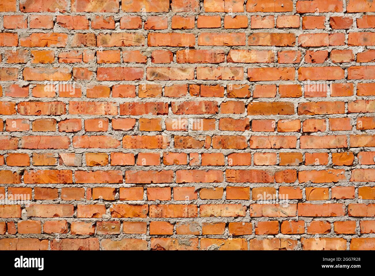 Red brick pattern wall background material. Masonry construction stone texture brick wall loft background. Brickwork background brick building wall Stock Photo