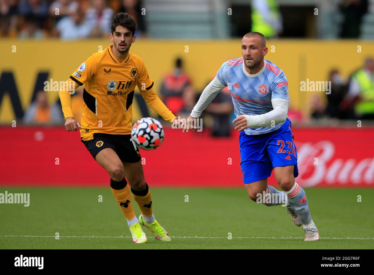 Luke Shaw #23 of Manchester United moves away from Francisco Trincao #11 of Wolverhampton Wanderers Stock Photo