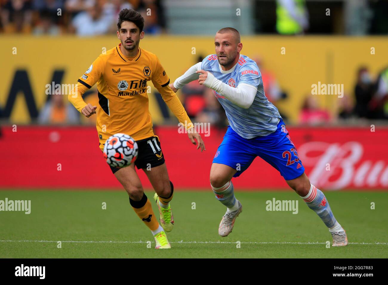 Luke Shaw #23 of Manchester United moves away from Francisco Trincao #11 of Wolverhampton Wanderers Stock Photo