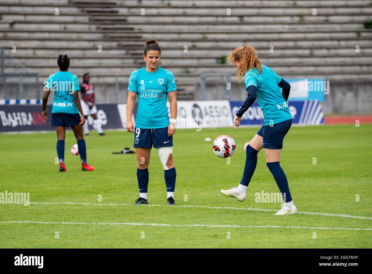 Mathilde Bourdieu of Paris FC and Celina Ould Hocine of Paris FC warm up ahead of the Women's French championship Arkema football match between Paris FC and EA Guingamp on August 28, 2021 at Robert Bobin stadium in Bondoufle, France - Photo Melanie Laurent / A2M Sport Consulting / DPPI Stock Photo
