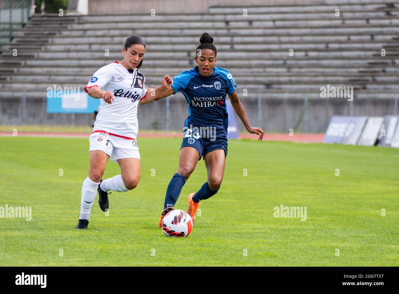 Manon Revelli of EA Guingamp and Eseosa Aigbogun of Paris FC fight for the ball during the Women's French championship Arkema football match between Paris FC and EA Guingamp on August 28, 2021 at Robert Bobin stadium in Bondoufle, France - Photo Melanie Laurent / A2M Sport Consulting / DPPI Stock Photo