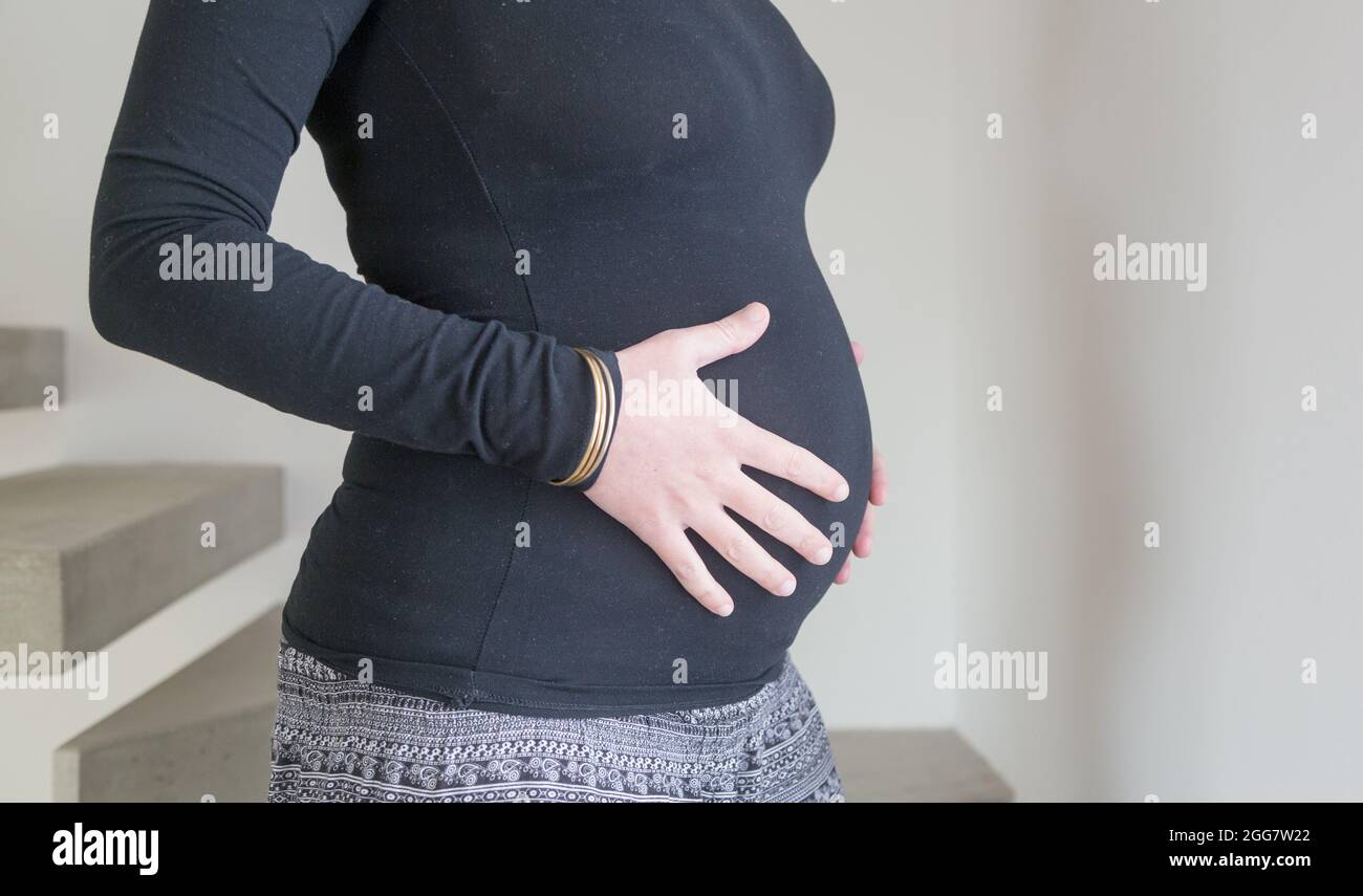 Pregnant woman, family, love and life concepts. Horizontal wide photo with copy space. Stock Photo