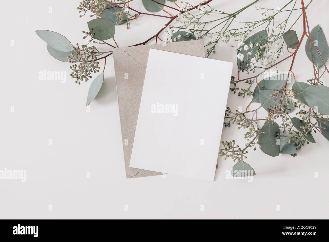 Stationary postcard mockup Invitation flatlay scene with tropical leaf JPG mock up