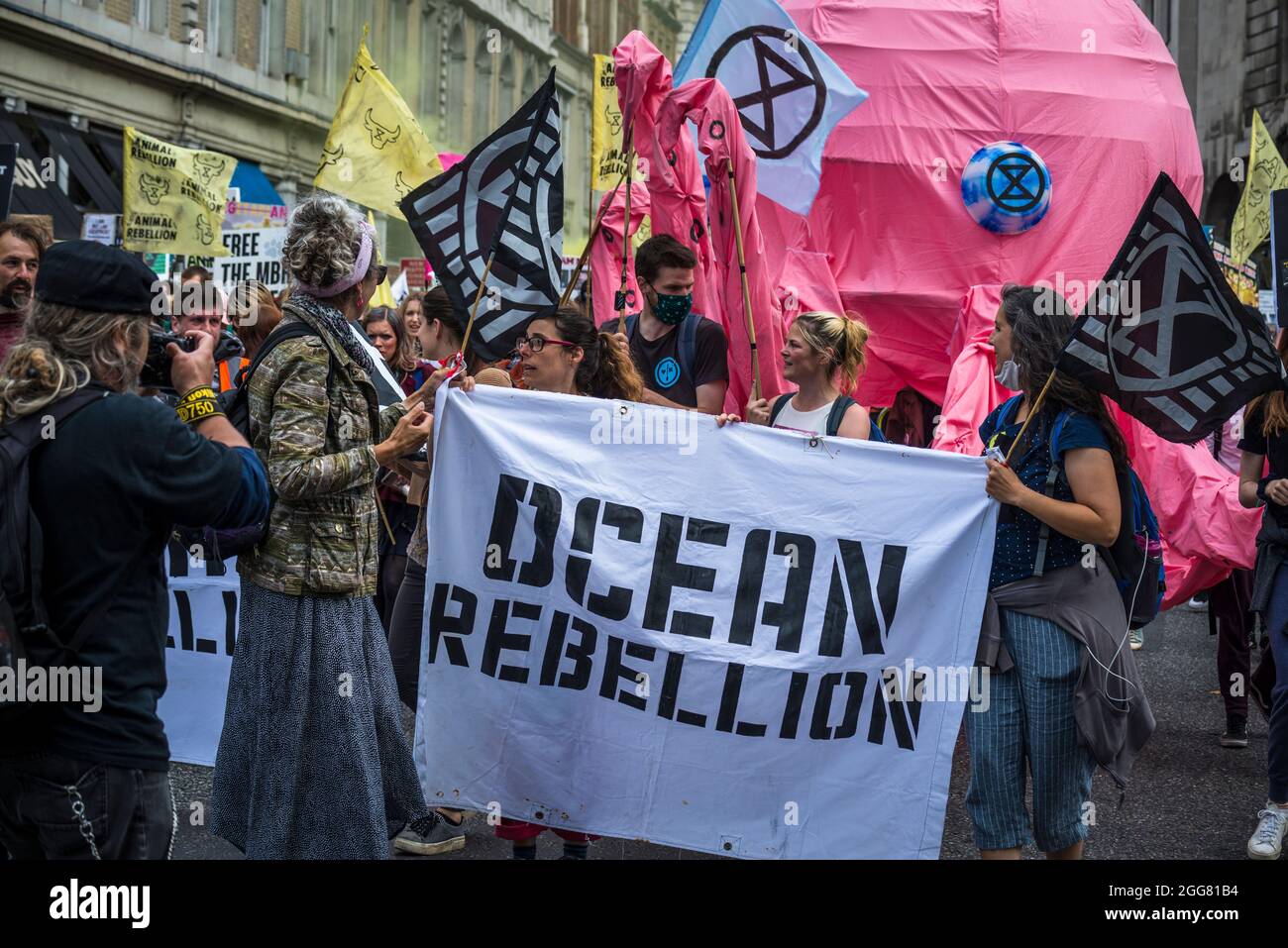 Ocean Rebellion,, National Animal Rights March, organised by Animal Rebellion and  Extinction Rebellion in the City of London, England, UK. Several thousand people joined the group that campaigns to transition our food system to plant-based system in order to tackle the climate emergency.  August 28 2021 Stock Photo