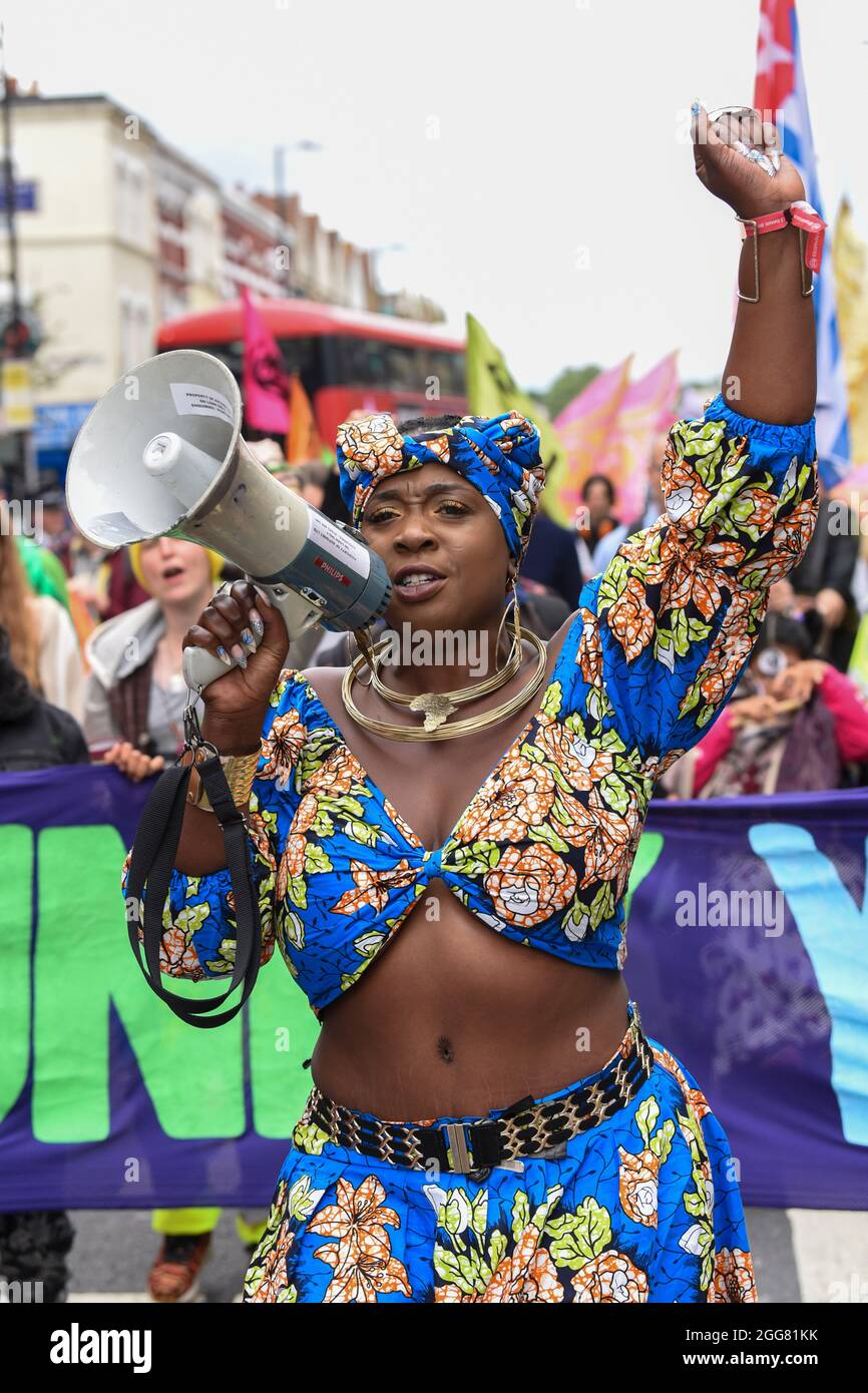 London, UK. 29th Aug, 2021. Activist and environmentalist Marvina Newton leads the march at Extinction Rebellion's Carnival for Climate Justice in London part of their two weeks of Impossible Rebellion protests.XR Unify is a BIPOC-led (black, Indigenous and people of colour) group who are taking action to put a stop to the fossil fuel industry. (Photo by Dave Rushen/SOPA Images/Sipa USA) Credit: Sipa USA/Alamy Live News Stock Photo