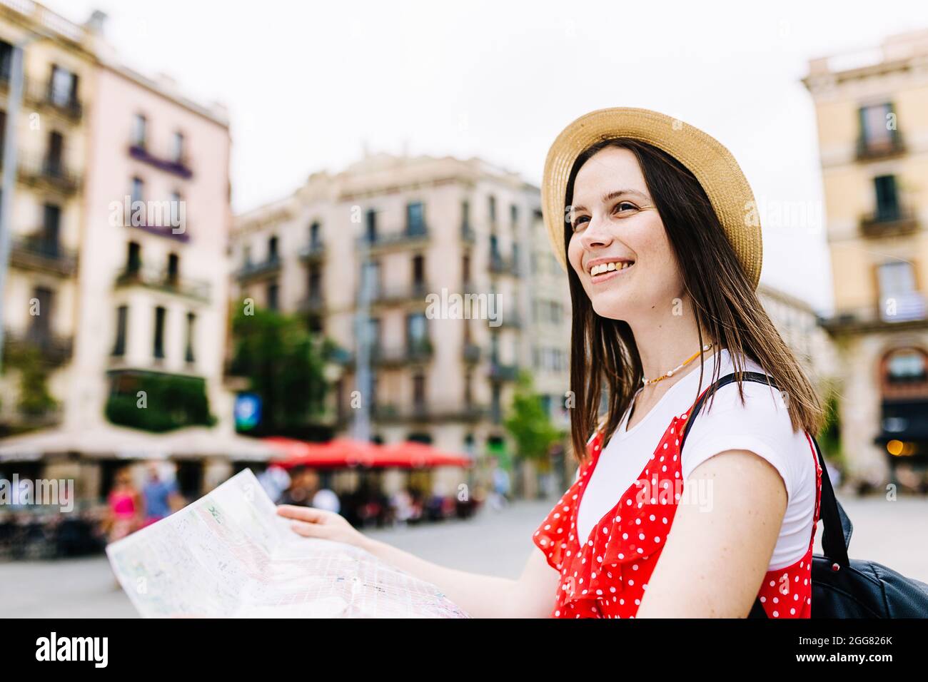 Happy young woman traveling alone Stock Photo