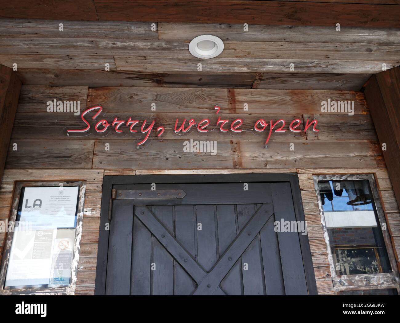 Los Angeles, California, USA 27th August 2021 A general view of atmosphere of Sorry We're Open Sign at Improv on Melrose Avenue on August 27, 2021 in Los Angeles, California, USA. Photo by Barry King/Alamy Stock Photo Stock Photo