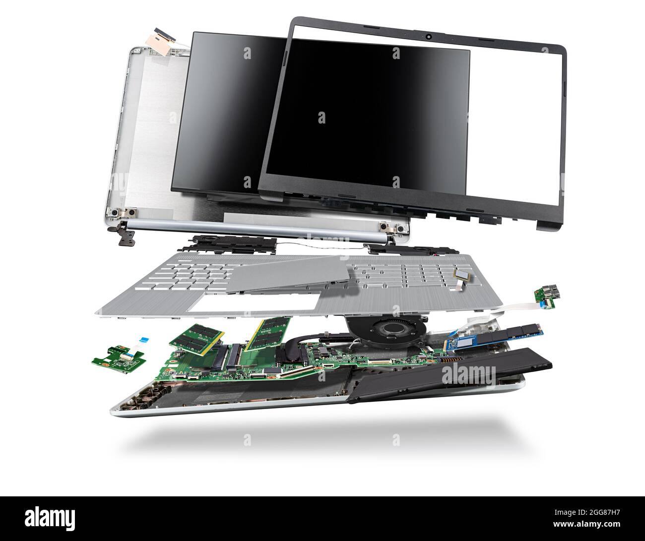 flying parts of a notebook computer. hardware components mainboard cpu processor display RAM cables and cooling fan flying out of silver laptop PC cas Stock Photo