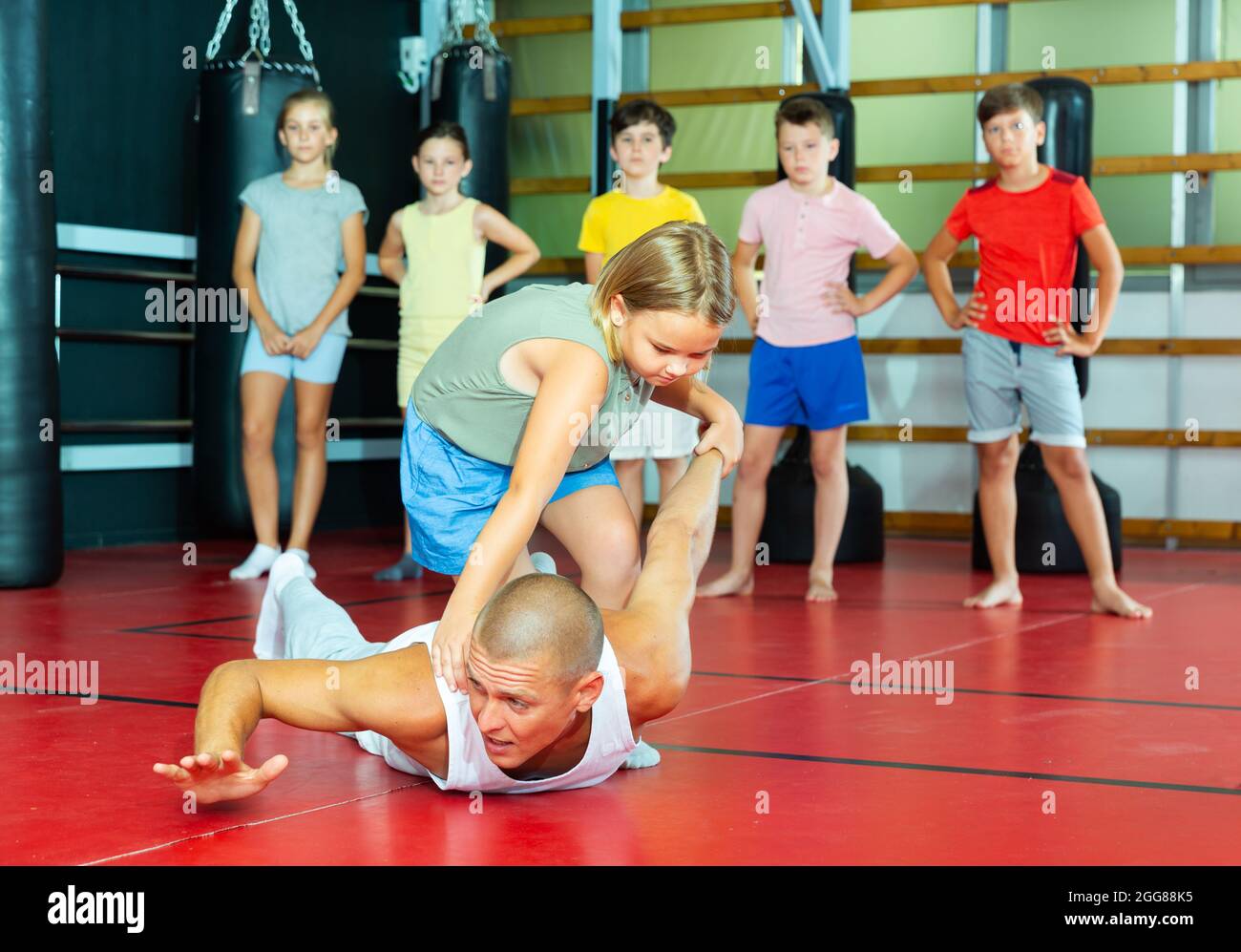 Children Practice Self Defense Techniques On Coach Stock Photo Alamy