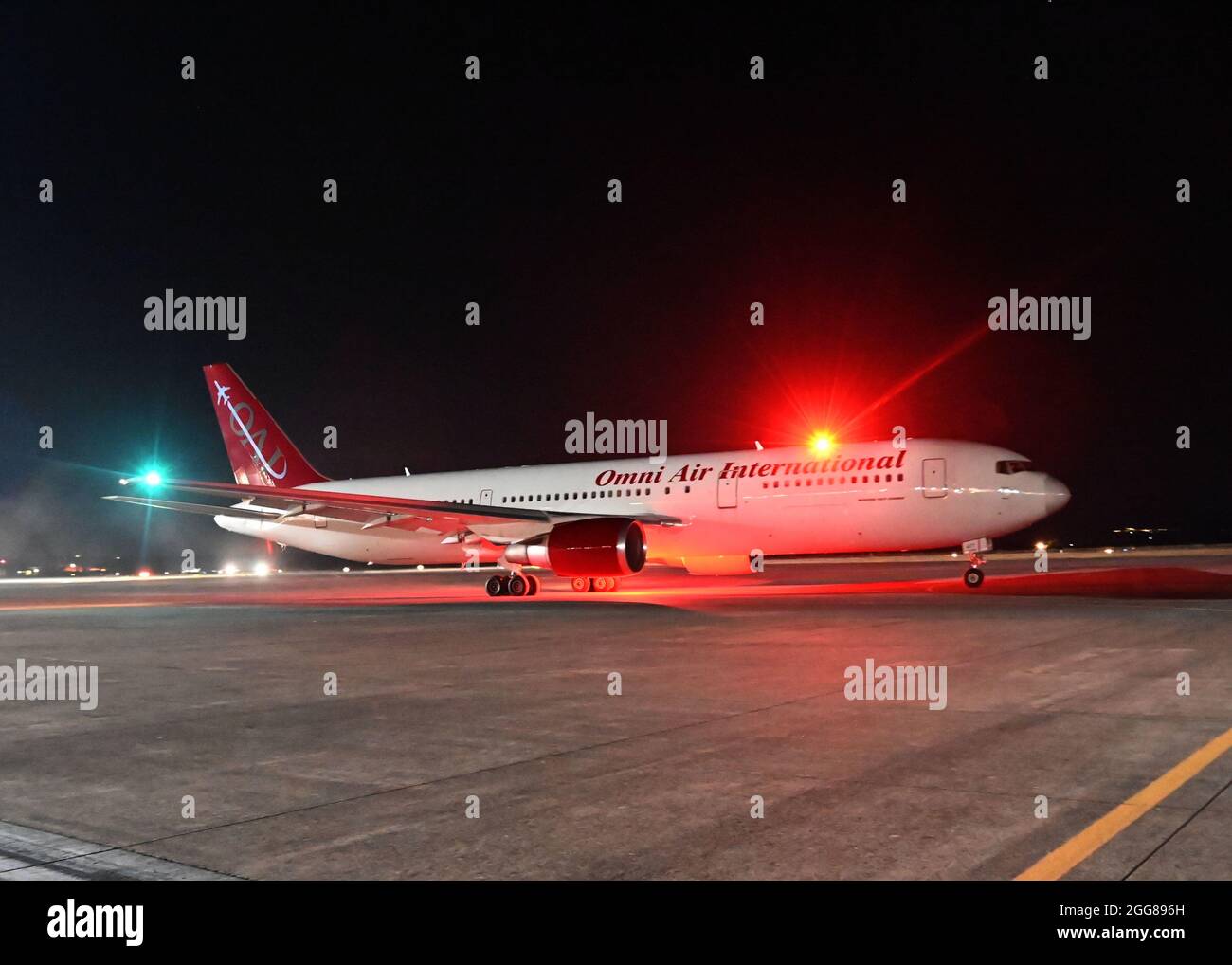 210829-N-OX321-1175 NAVAL AIR STATION SIGONELLA, Italy (Aug. 28, 2021) An Omni Air International Boeing 767-300ER aircraft with evacuees from Afghanistan departs Naval Air Station (NAS) Sigonella to the United States, Aug. 28, 2021. NAS Sigonella is currently supporting Department of State mission to facilitate the safe departure and relocation of U.S. citizens, Special Immigration Visa recipients, and vulnerable populations from Afghanistan. (U.S. Navy photo by Mass Communication Specialist 1st Class Kegan E. Kay) Stock Photo