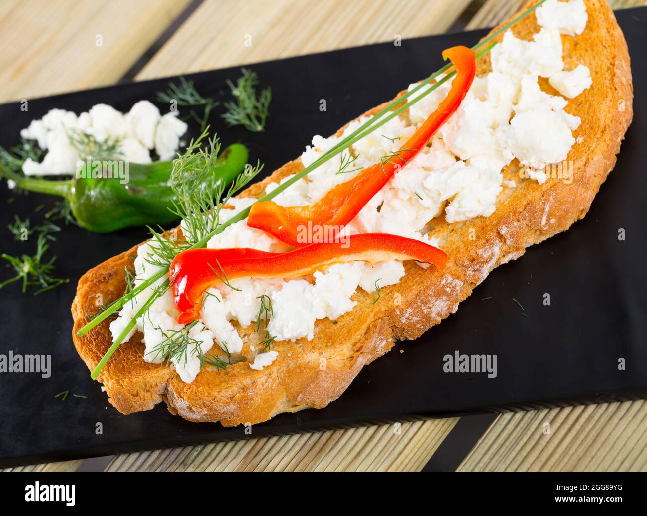 Toast with soft cheese and bell pepper Stock Photo - Alamy