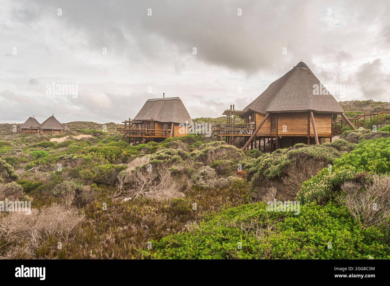 Chalets units build in African style architecture at Cape Agulhas National Park in South Africa which is the southernmost point of African Continent. Stock Photo