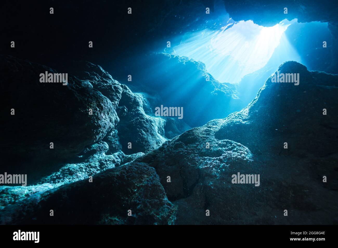 Rays of sunlight into the underwater cave Stock Photo