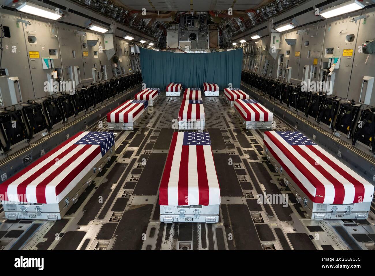 Dover, United States Of America. 29th Aug, 2021. Flag-draped transfer cases line the inside of a C-17 Globemaster II prior to a dignified transfer at Dover Air Force Base August 29, 2021 in Dover, Delaware. The remains of 11 Marines, a Navy medic and an Army staff sergeant, killed in Afghanistan were airlifted home. Credit: Planetpix/Alamy Live News Stock Photo