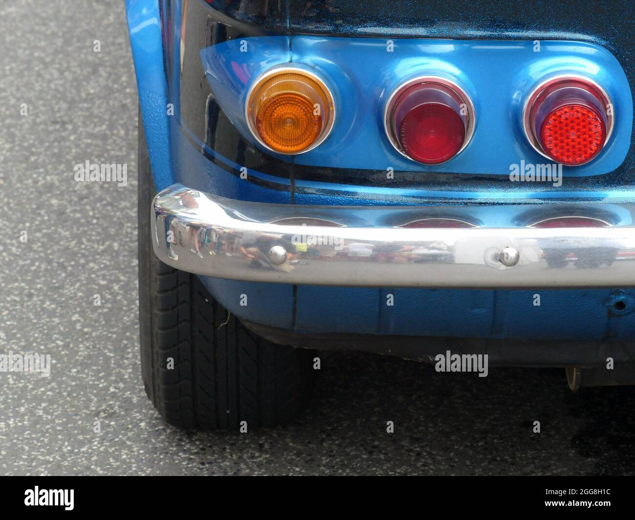Round taillights of a blue German rear-engine small race car of the ...