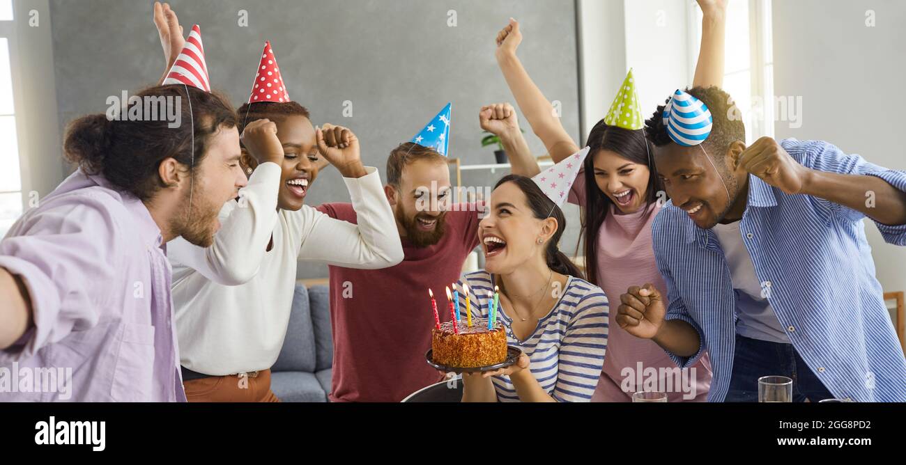 Banner with happy diverse people having fun and celebrating their friend's birthday Stock Photo