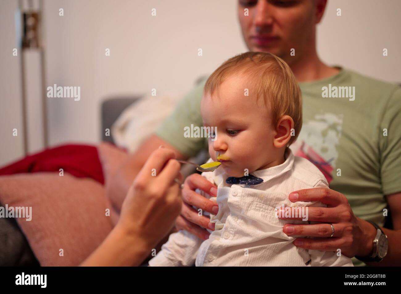 mother-and-father-feeding-their-little-baby-stock-photo-alamy