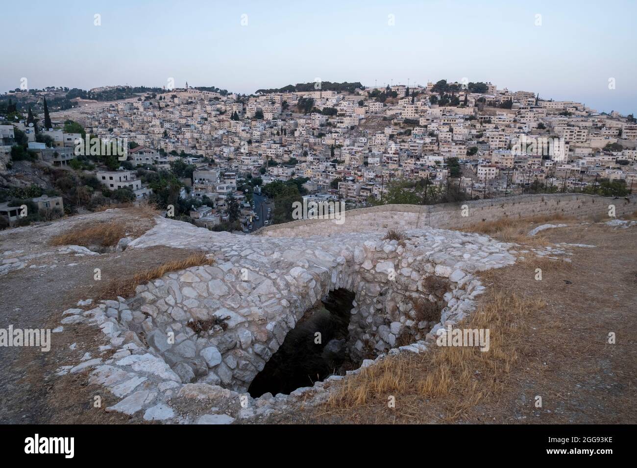 View of the Palestinian neighborhood of Silwan or Siloam a predominantly Palestinian neighborhood across a Crusader burial chamber that was reused by generations of families from as early as the seventh until the fifth century BC in Valley of Hinnom the modern name for the biblical Gehenna or Gehinnom valley surrounding Jerusalem's Old City, Israel Stock Photo