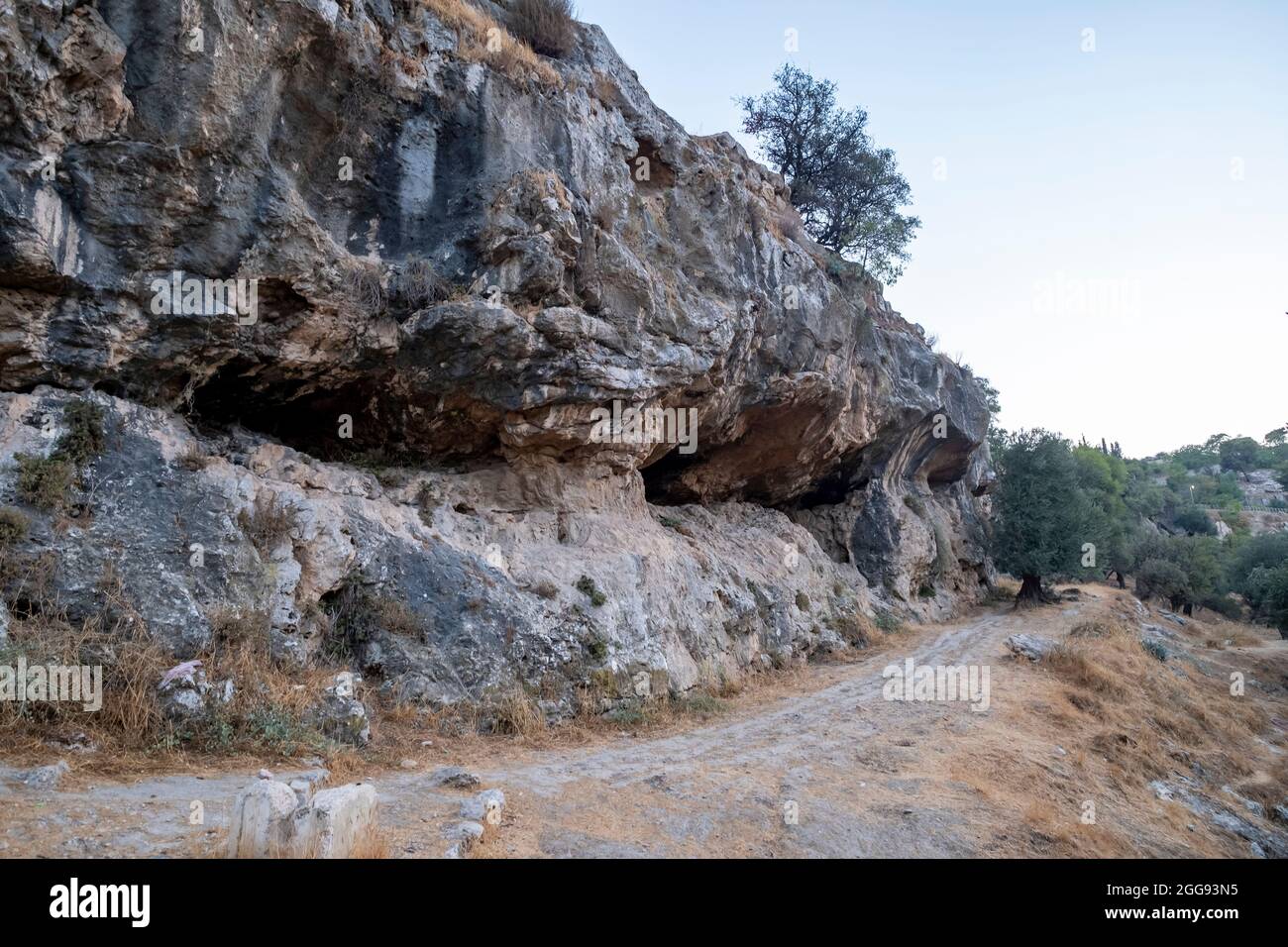 View of rock cut burial chambers that were reused by generations of families from as early as the seventh until the fifth century BC in Valley of Hinnom the modern name for the biblical Gehenna or Gehinnom valley surrounding Jerusalem's Old City, Israel Stock Photo